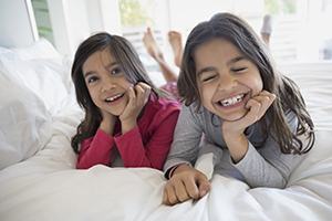 Two girls laughing.