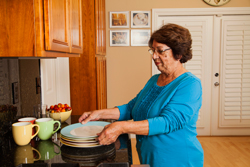 Woman lifting plates.